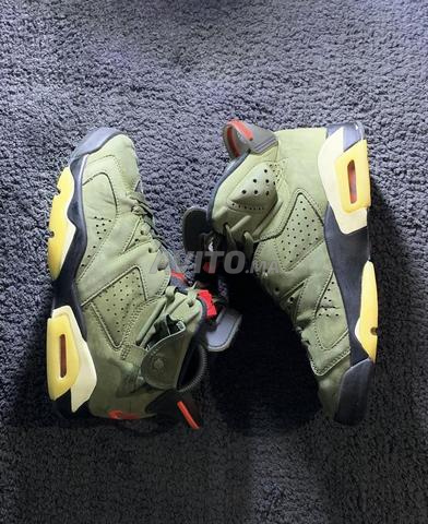 تراڤيس سكوت x تراڤيس سكوت الأصلي