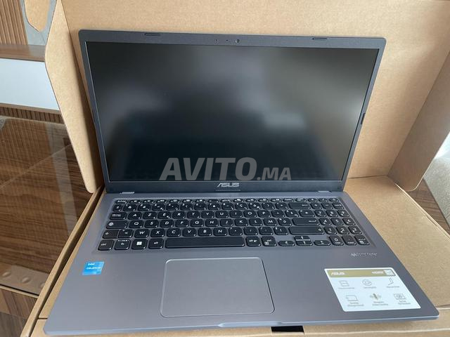 كمبيوتر محمول ASUS وطابعة Canon