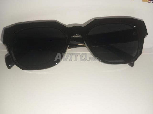 Lunettes de soleil de luxe Miu Miu - Design moderne avec des touches dorées - 2