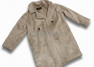 Manteau de fourrure en excellent état, idéal pour un hiver neuf