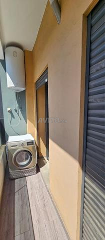 الجملة المترجمة هو: شقة جميلة بلوطة بن تاشفين.