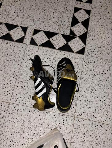 أديداس بريداتور بالس FG أسود وذهبي ميتاليك