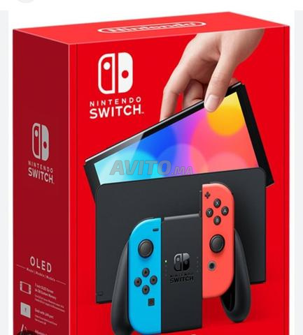 سويتش نينتندو OLED مع لعبتين