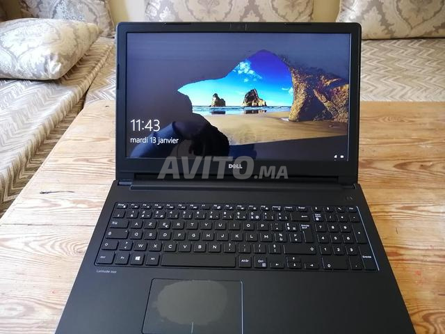 كمبيوتر محمول ديل وفأرة بلوتوث