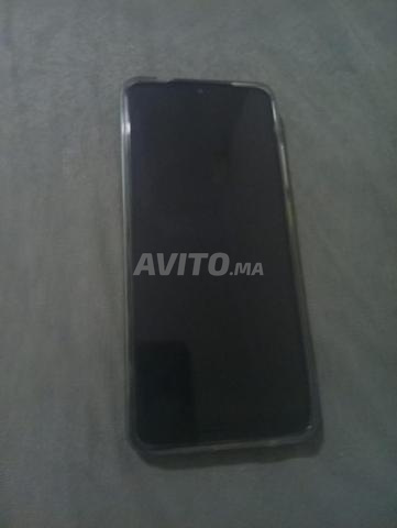 Téléphone portable encore propre, type Redmi A5