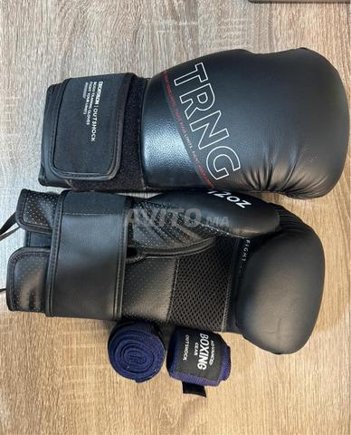 قفازات ملاكمة Outshock TRNG 12 أوقية وأربطة جديدة