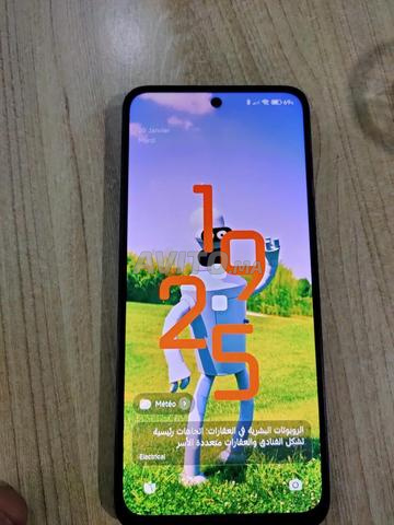 Redmi 12 en très bon état comme neuf