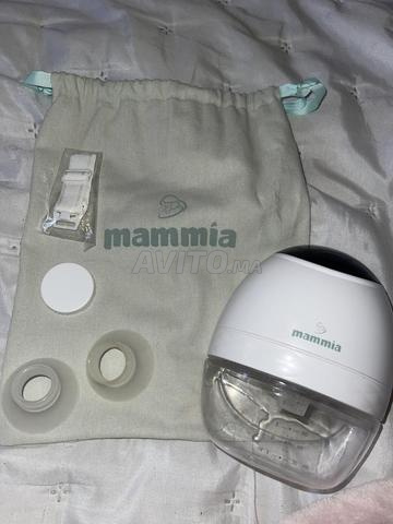 مضخة حليب الثدي اليدوية بدون استخدام اليدين مع الكرتون