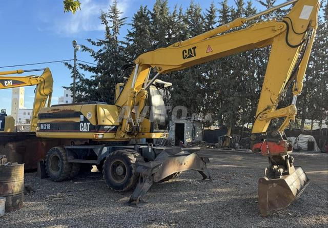 POCLAIN M 318 diwana jdida 2026