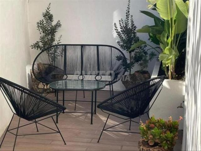 Salon d'extérieur en corde et fer pratique