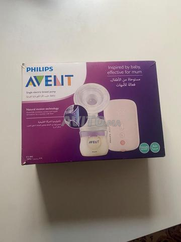 Tire lait presque neuf