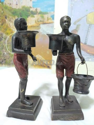 Paire de chandeliers artistiques anciens en bronze