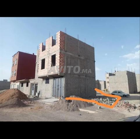 أرض في تامنصورت مساحة 82 - 2