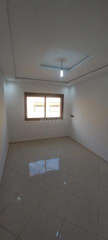 Location appartement 90m² 3 chambres salon 1er étage ascenseur parking interphone