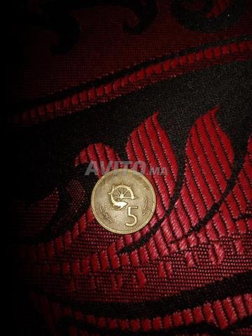 Pièces de monnaie et bague en argent