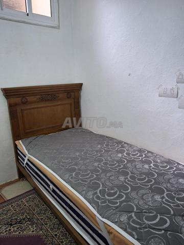 Lit en bois sculpté – sans métal