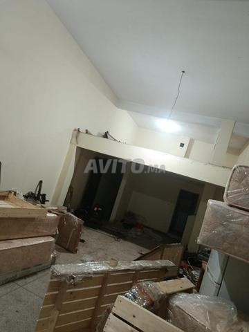 Immeuble avec cave et garages en duplex 