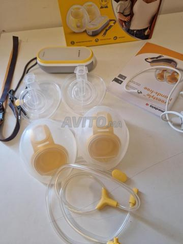 Tire lait medela main libre en très bon état