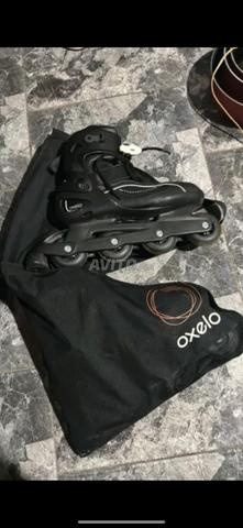 أحذية تزلج بعجلات Oxelo في حالة جيدة جداً مع حقيبة أصلية