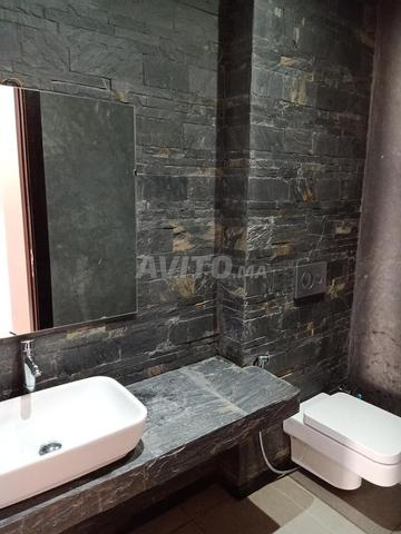 Rez de jardin luxueux meublé à louer Jnane Souissi - image 3