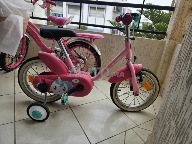 دراجة هوائية للبنات B’TWIN 14 مع عجلات تثبيت