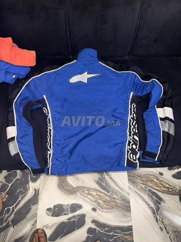 جاكيت ديال المطر XL ببروتيج للحماية من الصدمات