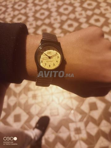 ساعة يد Q&Q Quartz أصلية - تصميم كلاسيكي أنيق