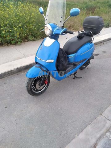 سكوتر موديل 2021 4t بحالة ممتازة 100 سي سي - 2