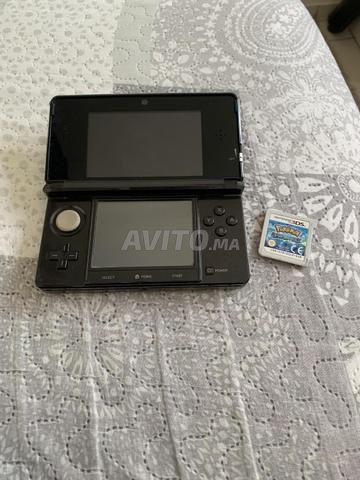 Nintendo 3DS avec son chargeur et jeu Pokémon - 2