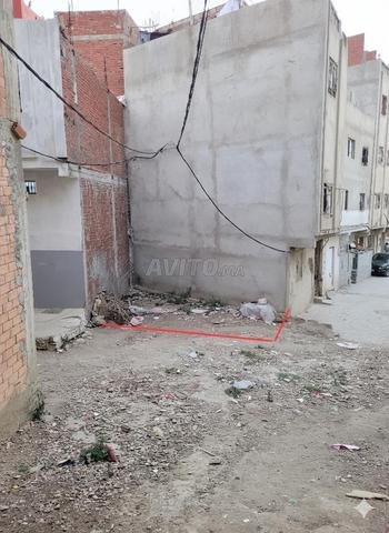 Terrain à vendre à Laâouama, rue 5m, quartier avec permis