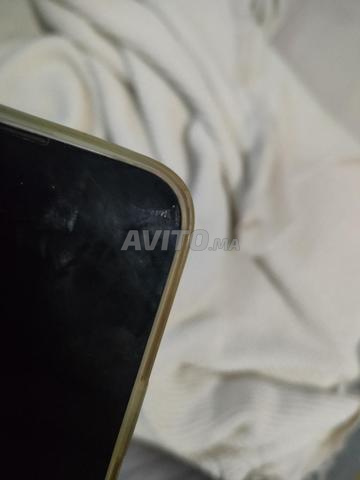 iPhone 13 rose batterie en réparation - 2