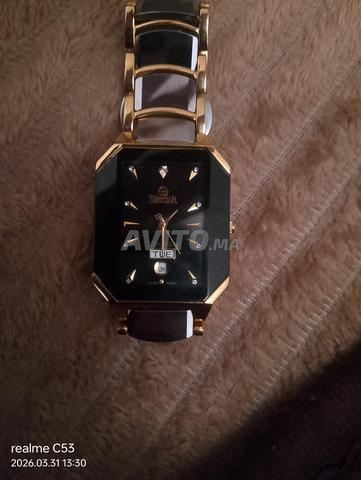 ساعة سويستار أصلية مطلية بالذهب عيار 22 والتنجستن