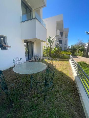 شقة بالطابق الأرضي بحديقة للكراء 3 غرف نوم بعين الذياب - 2