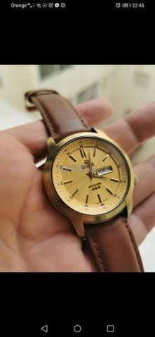 ساعة سويستار أصلية ذهب 23 قيراط
