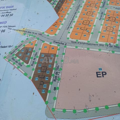 أرض بواجهتين 120 متر مربع مرآب 3 تجزئة