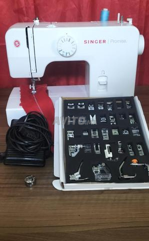 ماكينة خياطة سنجر مع 32 ملحق