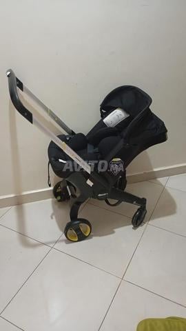 Poussette siège auto 2x1 la marque Doona