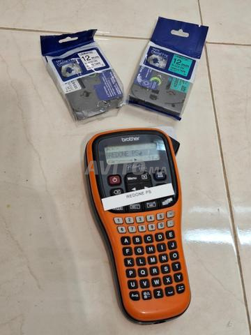 آلة طباعة الملصقات Brother P-touch PT-E100 مع شريطين