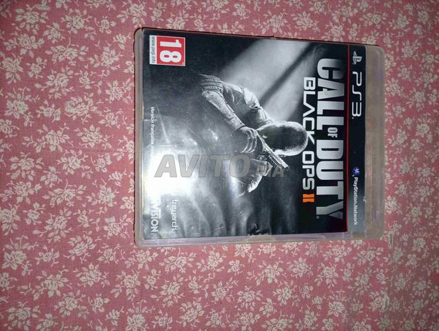 PS3 slim flashée avec 2 CD - 2