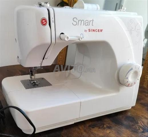 ماكينة خياطة سنجر آلة الخياطة