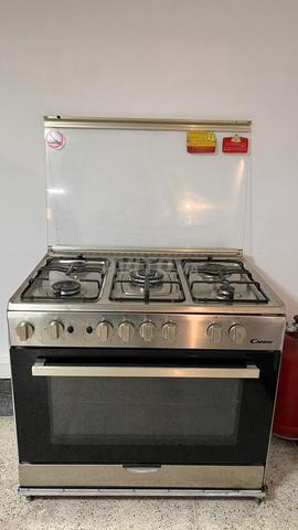 Cuisinière gaz Candy inox 5 feux et four à gaz