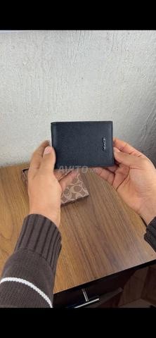 محافظ ماركات رجالية - 2