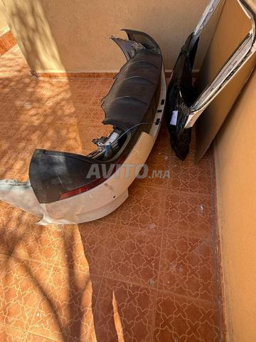 Optique et pare choc Av/Ar Macan - 2