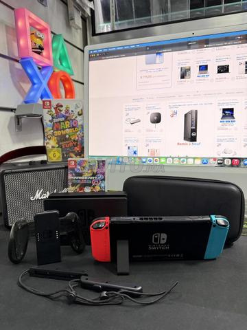 نينتندو سويتش V1 مع ملحقات ولعبتين Mario - 2