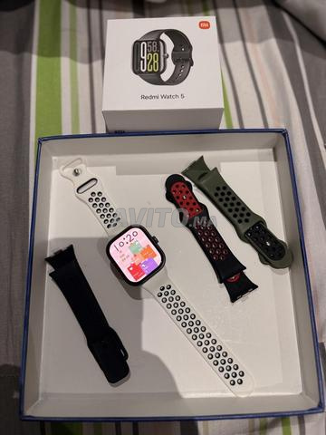 ساعة ريدمي واتش 5 بحالة شبه جديدة + 4 أساور