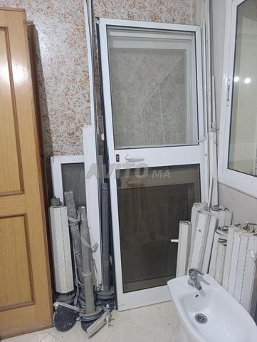 Portes en bois et aluminium, fenêtres, placards lavabo