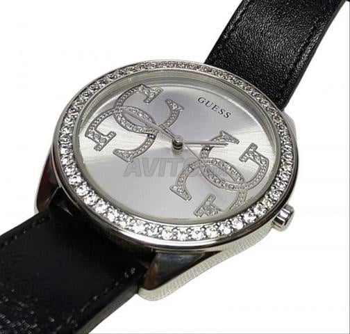 Une montre de marque Guess en bon état.
