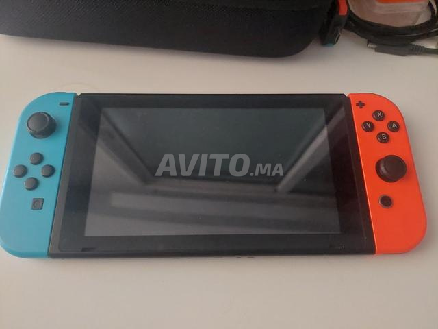Nintendo Switch v1, 2 joycon supplémentaires et son sac - 2
