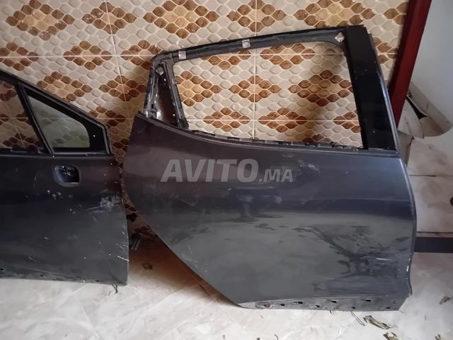 Porte capot voiture Clio 4 - 2