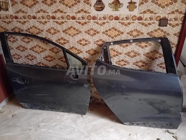 Porte capot Clio 4 - 2